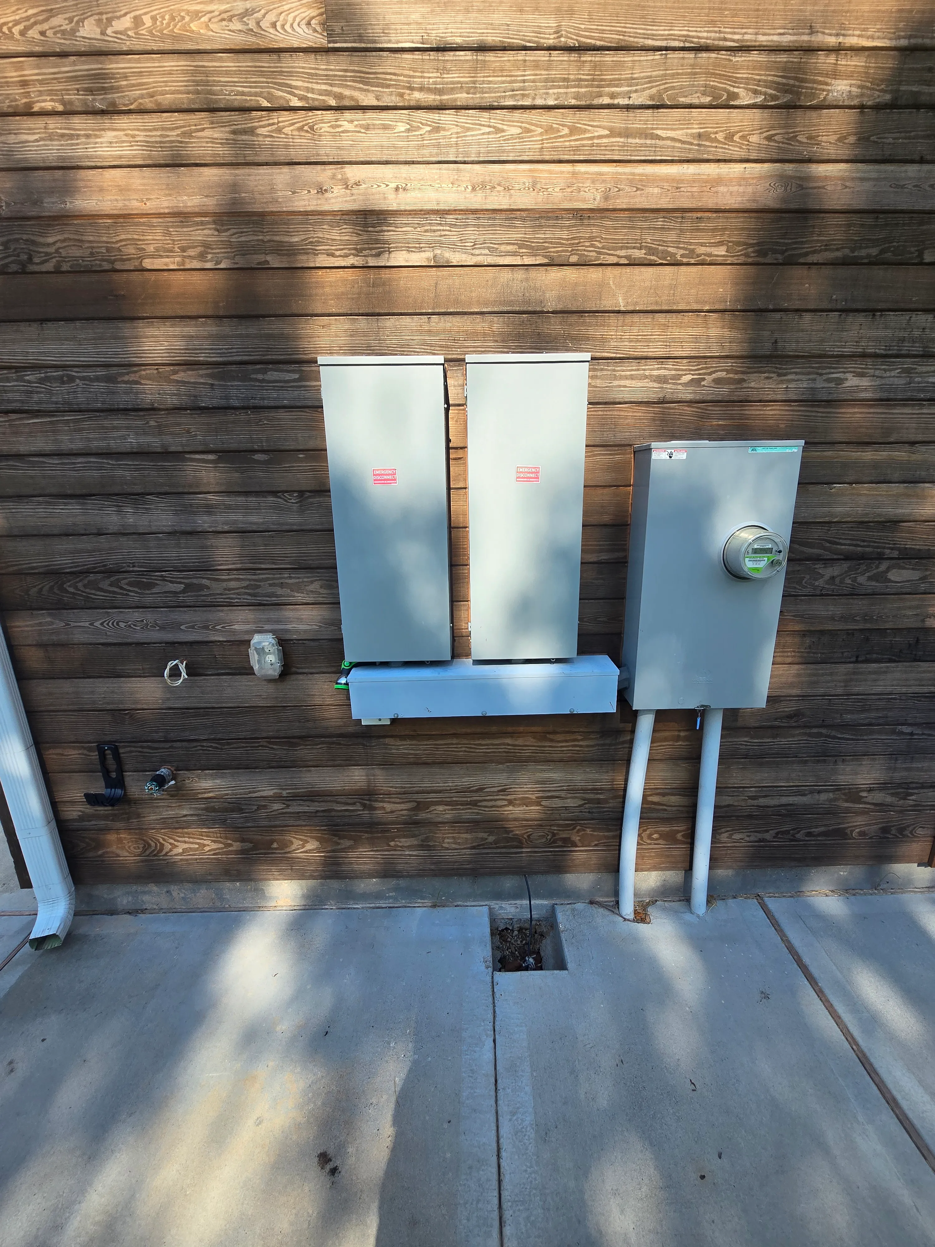 Two exterior electrical disconnects mounted beside each other.