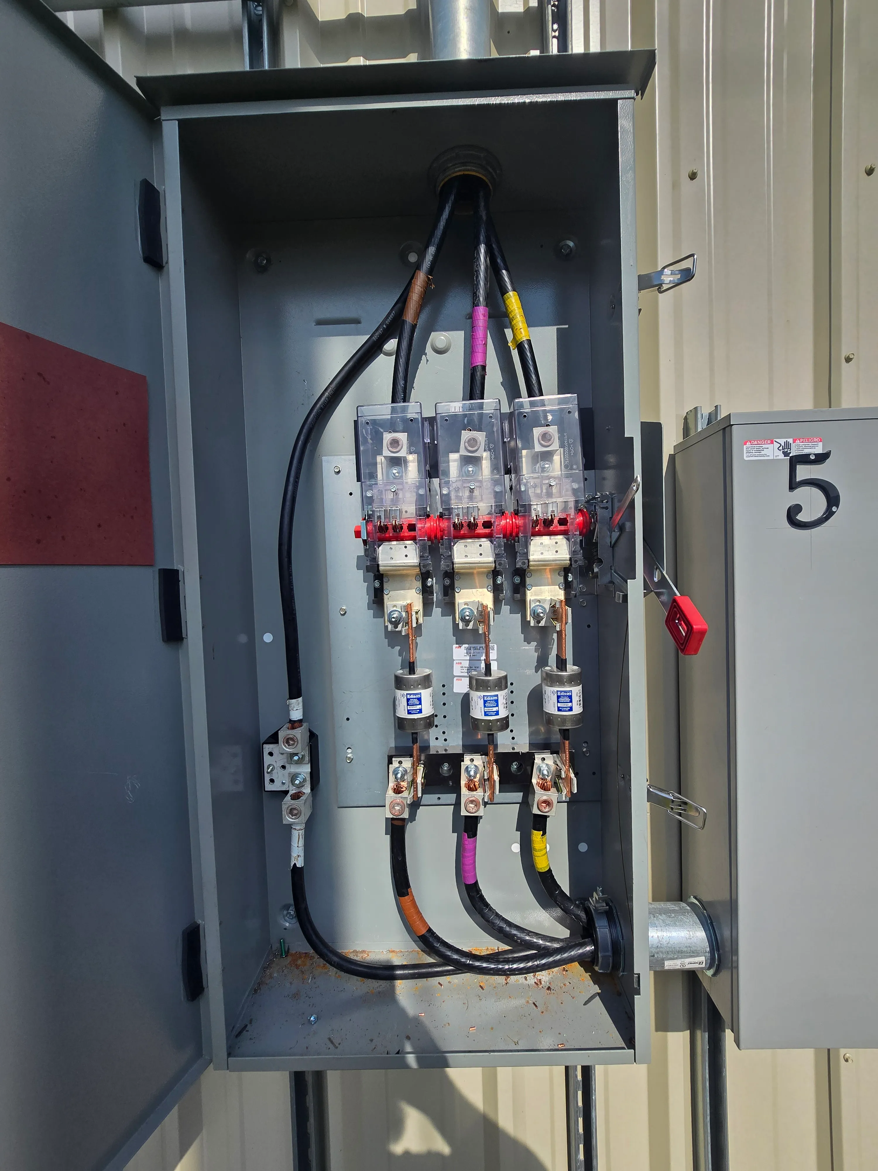 Close-up view of electrical service equipment and disconnect components.