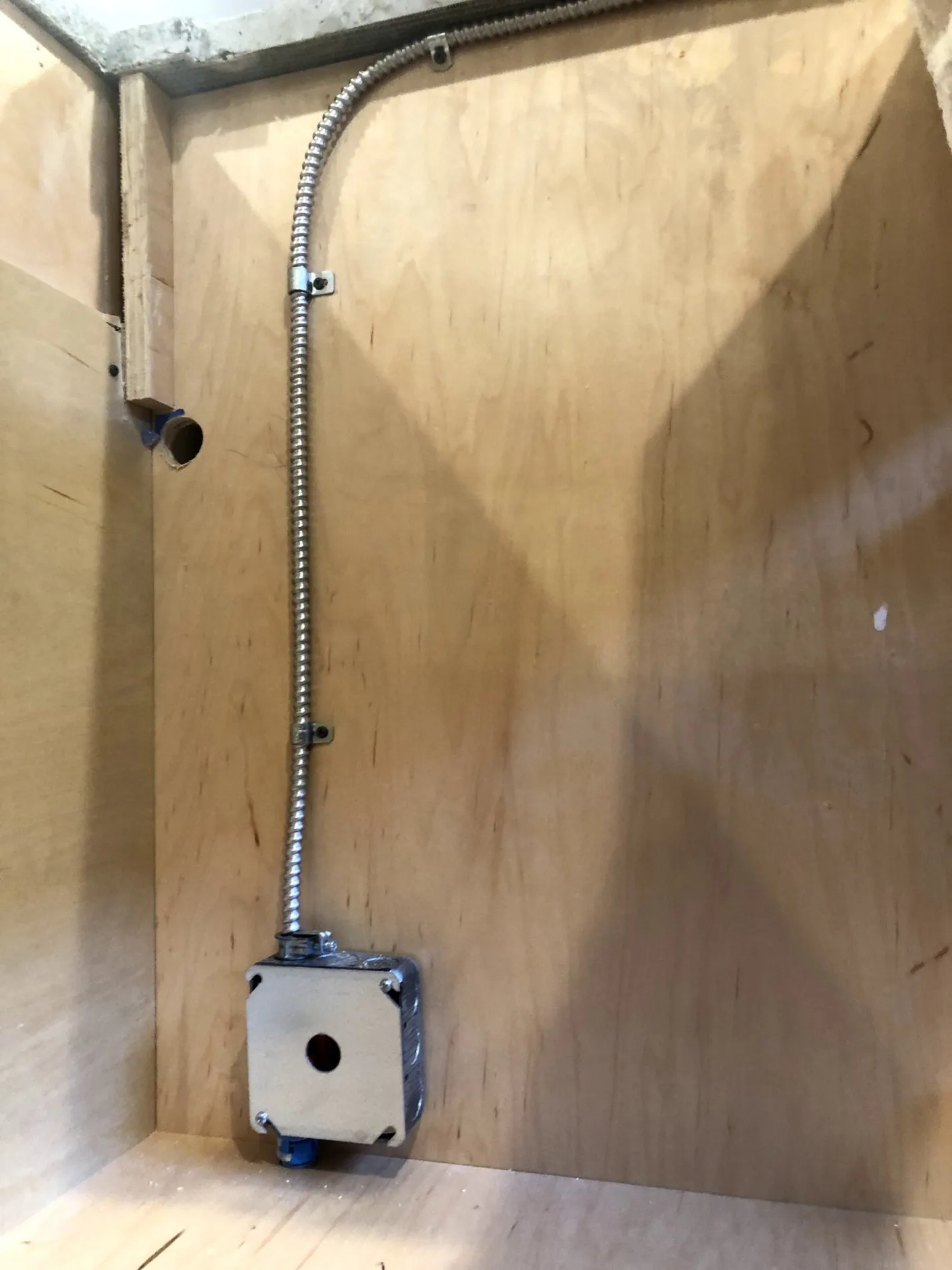 Under-cabinet electrical detail with lighting and outlet placement.