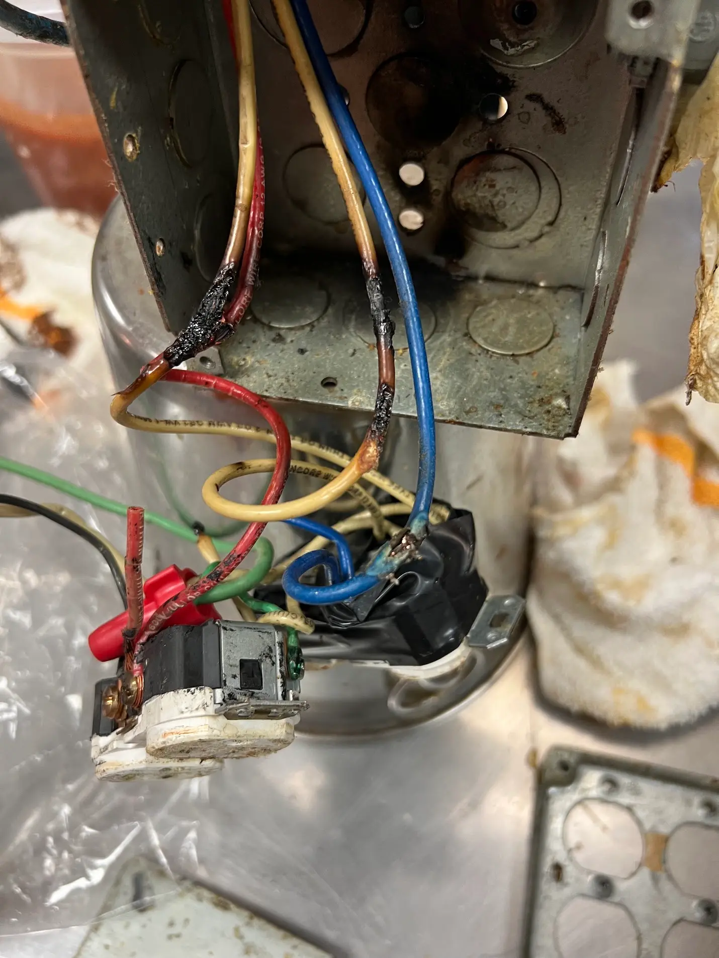 Burned wiring inside an electrical box found during electrical troubleshooting