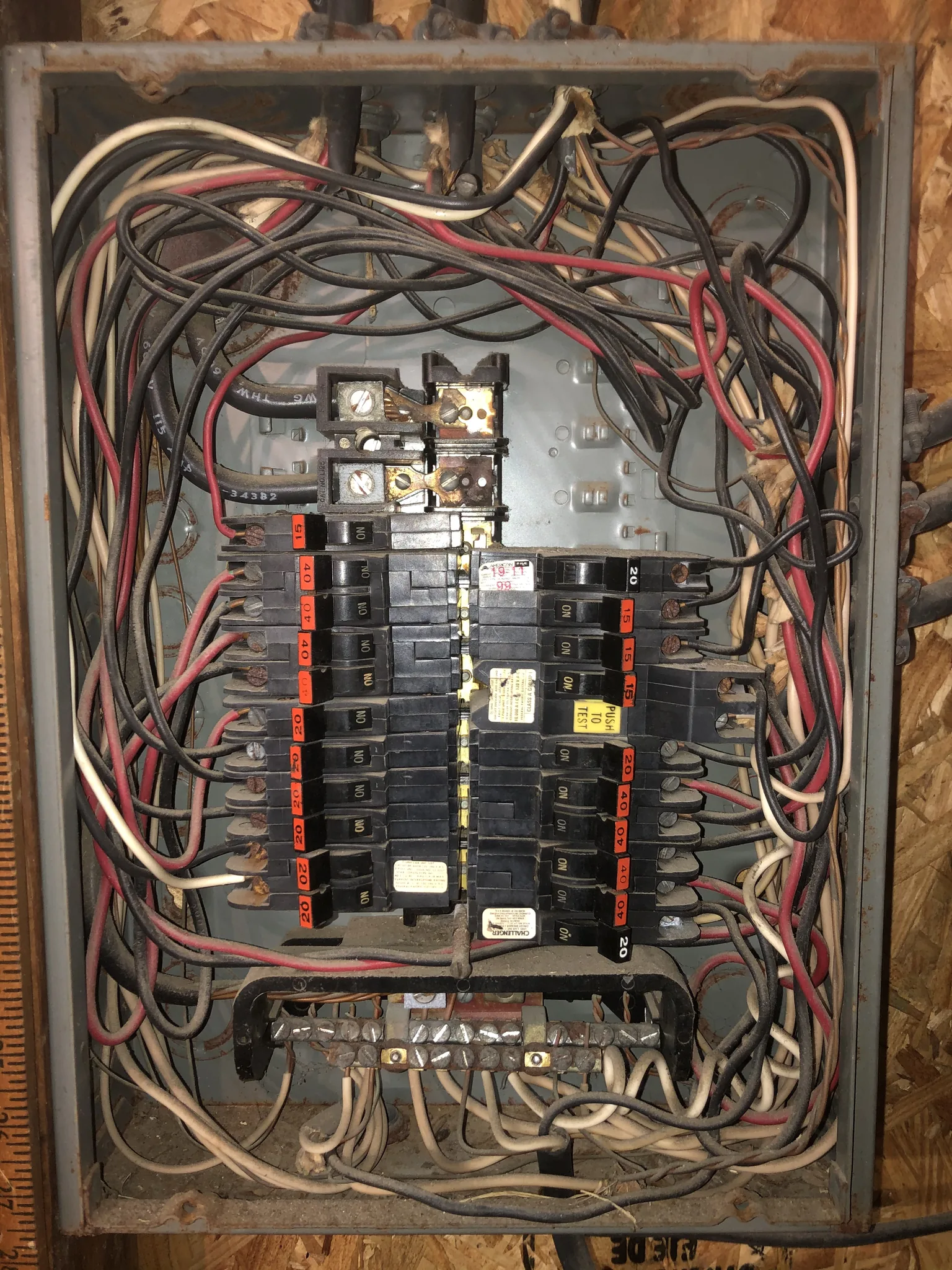 Crowded Federal Pacific electrical panel with old wiring and breakers