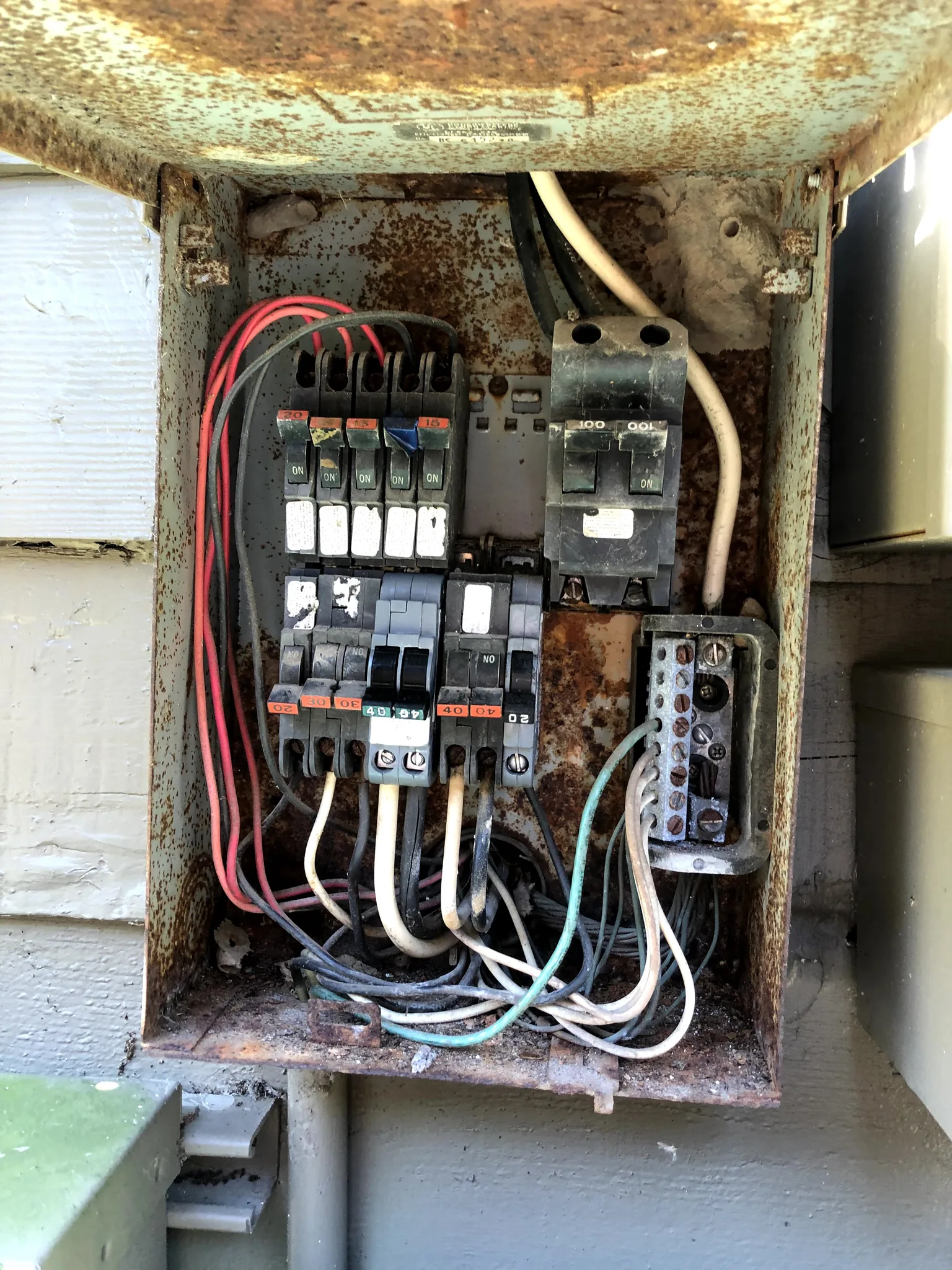 Older Federal Pacific electrical panel with exposed breakers and aging wiring