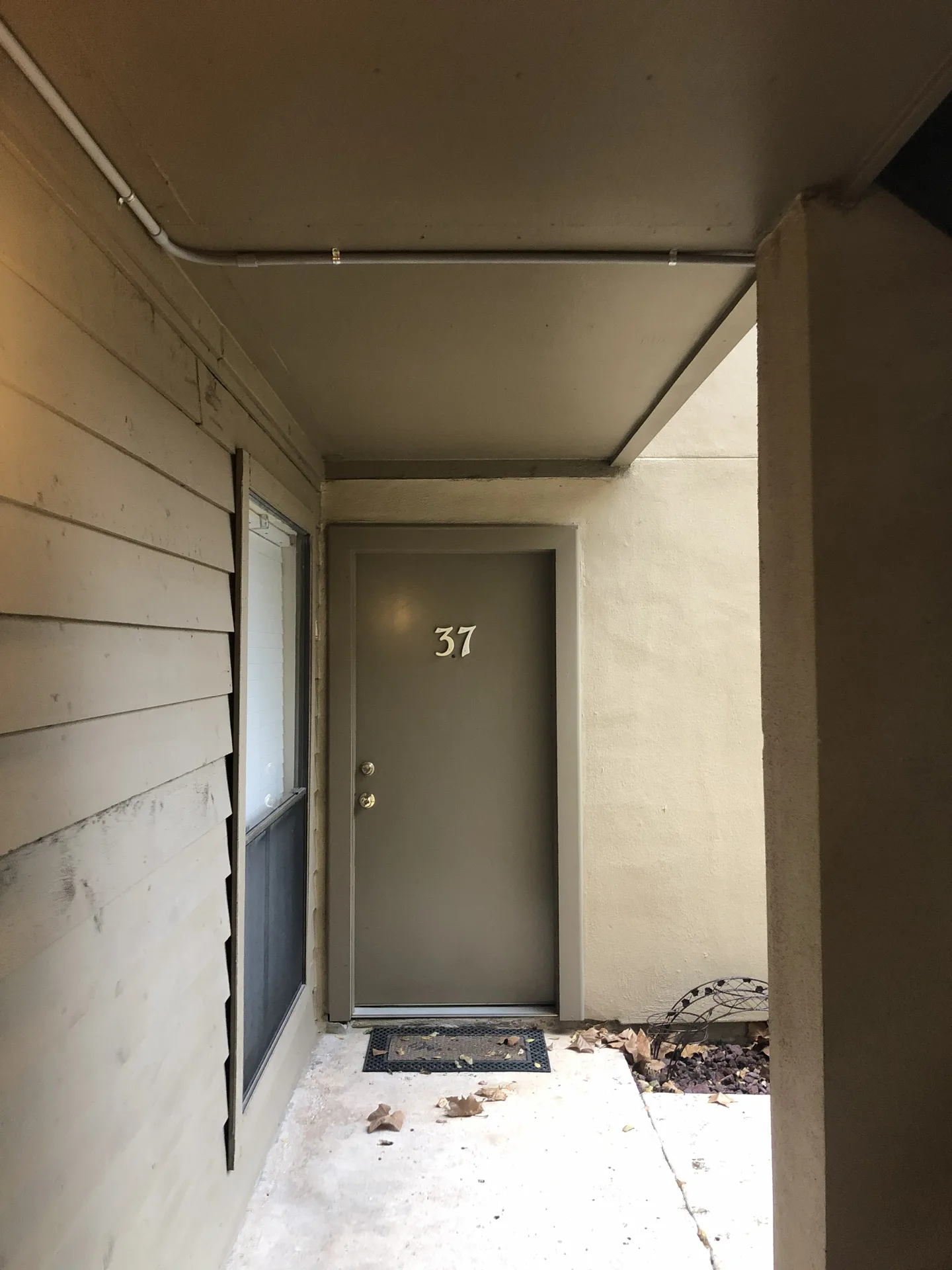 Residential entry area with finished exterior electrical lighting detail.