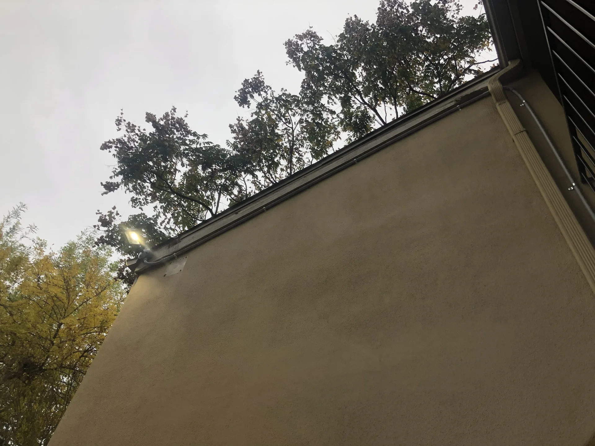 Residential exterior electrical installation on a finished home.