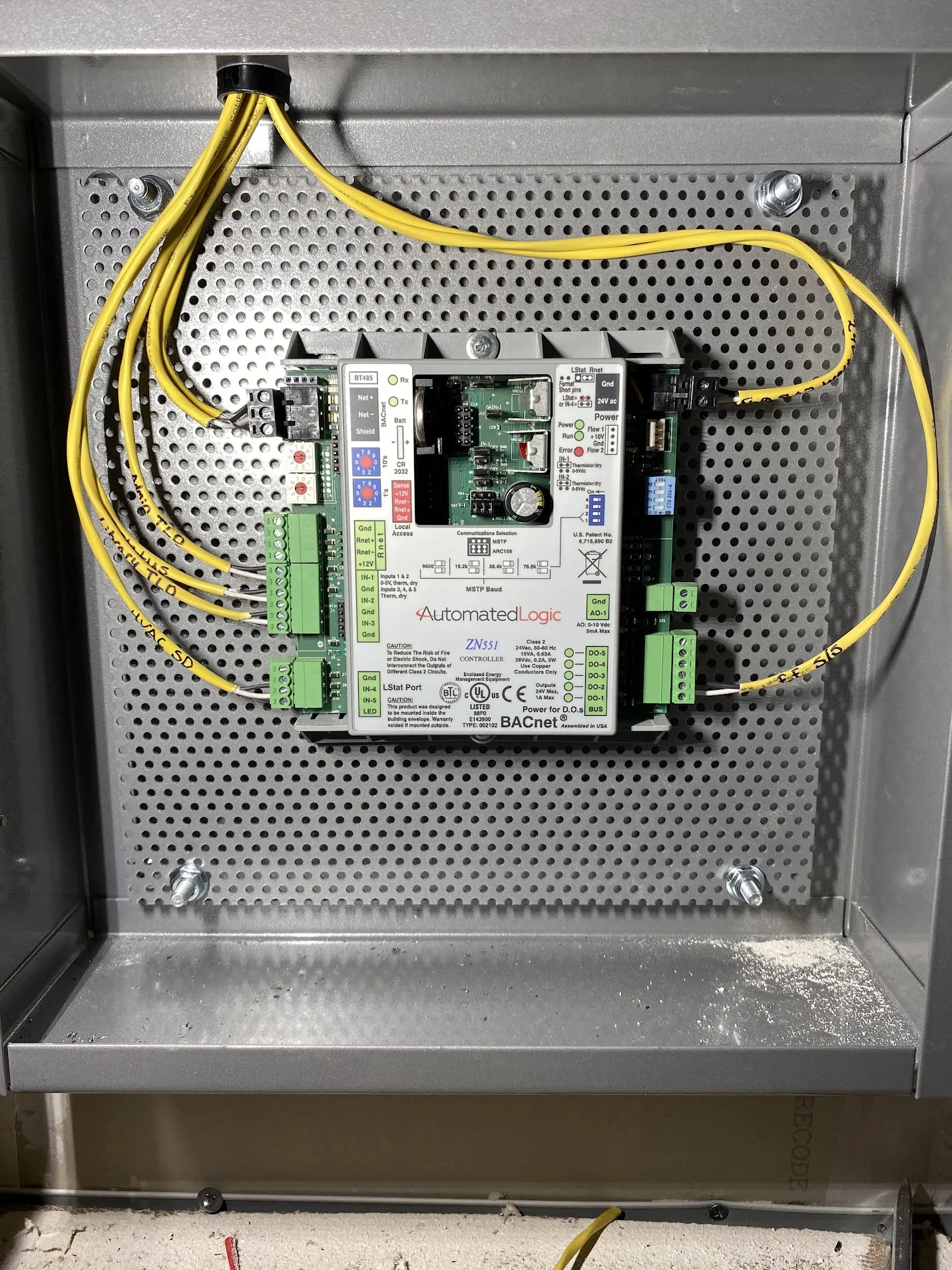 Low-voltage control components mounted neatly inside a panel.