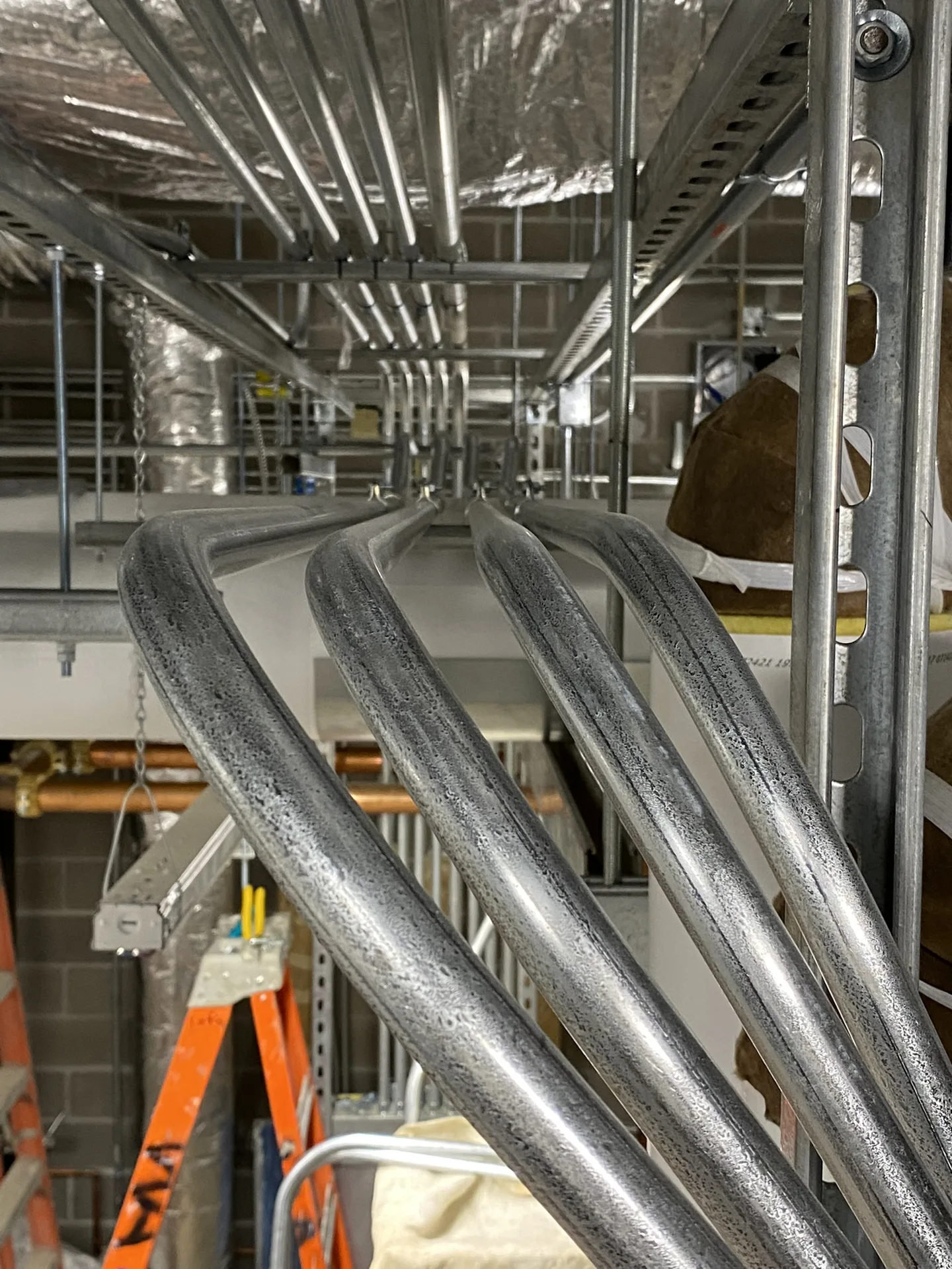 Commercial conduit runs installed overhead with organized routing.
