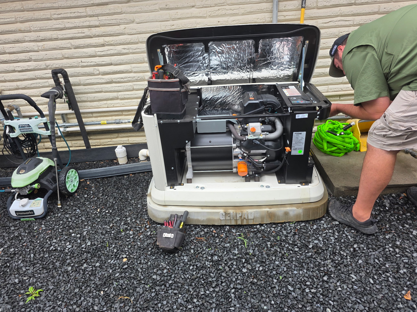 Generator installation work on an open residential standby unit near League City
